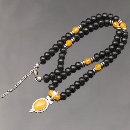 Colgante de león de latón, collar de macramé con cuentas de piedra de lava y ónix negro natural